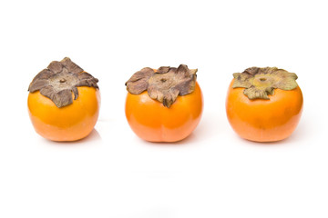 Sharon fruit isolated on a white studio background.