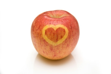 Fuji apple with a heart design on the skin.