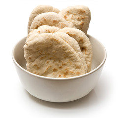 bowl of pita breads on a white background