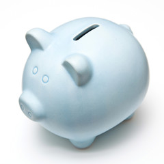 Blue piggy bank isolated on a white studio background.