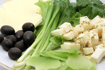 Close-up of cheese and vegetables with olives