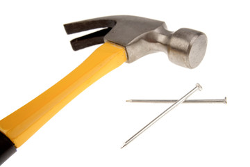 Hammer and nails on white