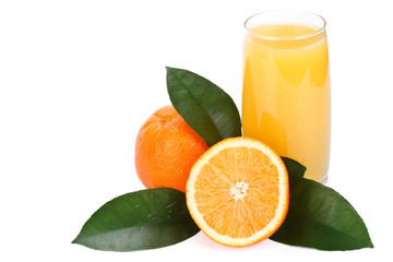 Fruits with green leaves and glass of juice