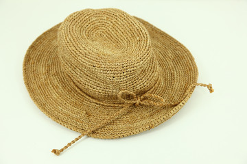 Straw brimmed hat on isolated white background