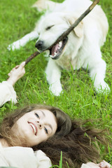 Girl with the golden retriever in the park