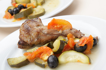 Baked rabbit leg with vegetables