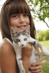 Cute girl holding a cat