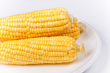 some corn on a porcelain dish