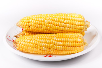 some corn on a porcelain dish
