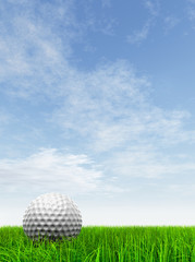 conceptual 3D golf ball on green grass over a blue sky