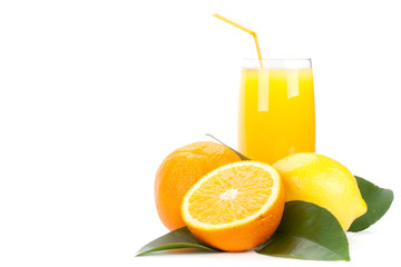 Fruits with green leaves and glass of juice