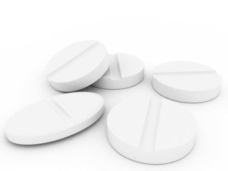 Tablets laying on a white background