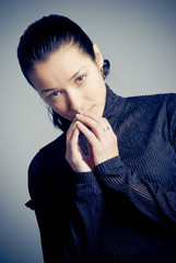 Low-key studio portrait of beautiful woman