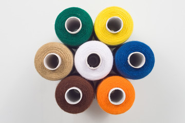 colored sewing spools in hexagon shape