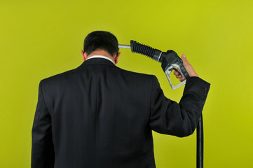Businessman committing suicide with a gas nuzzle