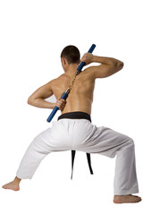 Young Sporty Karate Man Doing Special Exercise Isolated on White