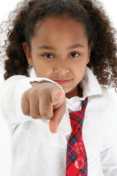 Adorable five year old African American Girl pointing.