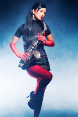 Young woman with saxophone