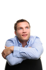 Obraz premium Dreaming man is sitting on a chair