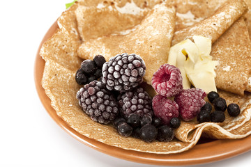 pancakes served with raspberries and blackberries