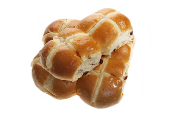 Easter hot cross buns stacked on a flat plate
