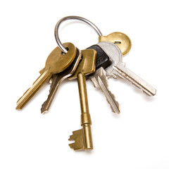 Bunch of house keys on a white background.