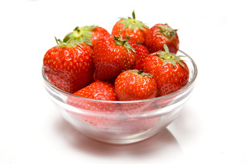 Bowl of strawberries isolated on a white background