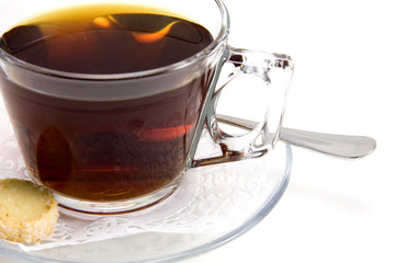 Cup of tea whith cookie on white background.