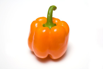 Orange bell pepper on a white studio background.