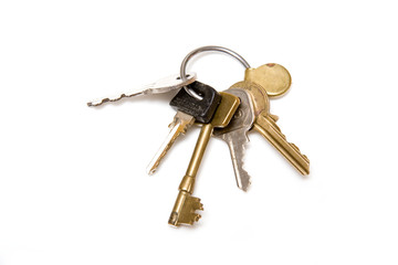 Bunch of house keys on a white background.