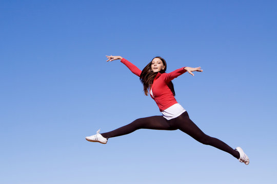 Young athletic woman jumping