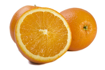 Three fresh oranges on white background