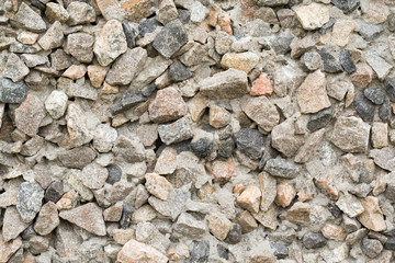 The facade of the house decorated by small stones