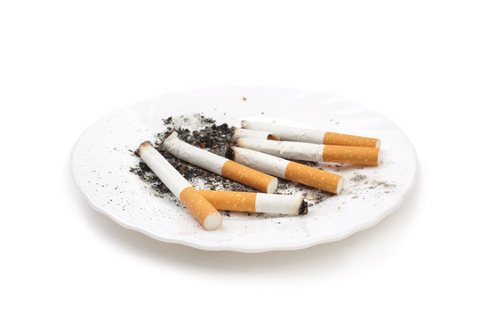 cigarette buts on plate