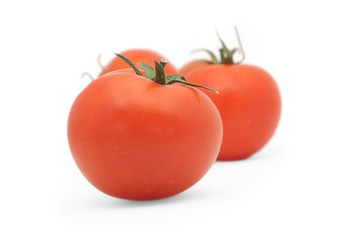 Red tomatoes isolated on white