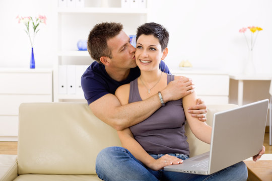 Love couple using laptop computer