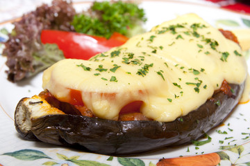 Tasty eggplant stuffed with tomatos and cheese