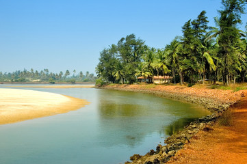 Kind on river bank in India