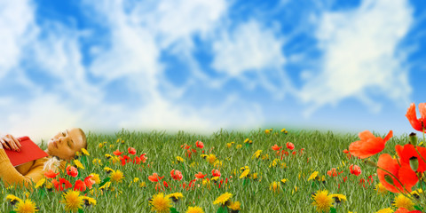 girl sleeping with red book in grass on dreamy meadow