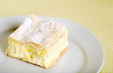 custard cake square on a plate