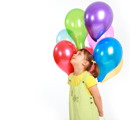 little girl holding colorful balloons on a white background