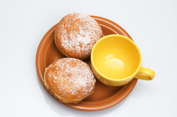 Two sweet buns and tea cup