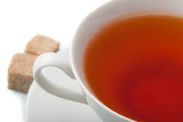 cup of tea with brown sugar isolated