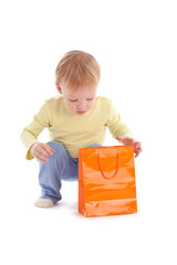 Boy open shopping bag with gift