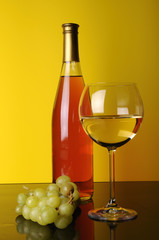 White wine and a grape