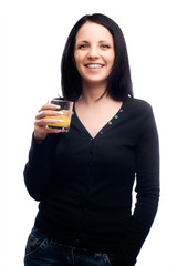 Healthy young woman drinking glass of orange juice