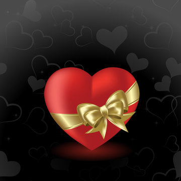 Heart  on a black background with gold bow