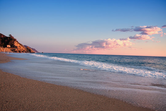 Mediterranean beach in sunset,liguria , italy