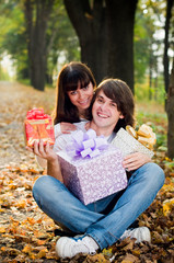 Young couple with gift boxes