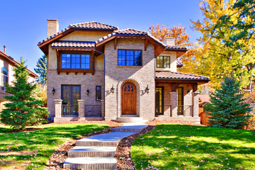 Home Front in All Brick with Green Lawn in Fall Season - obrazy, fototapety, plakaty